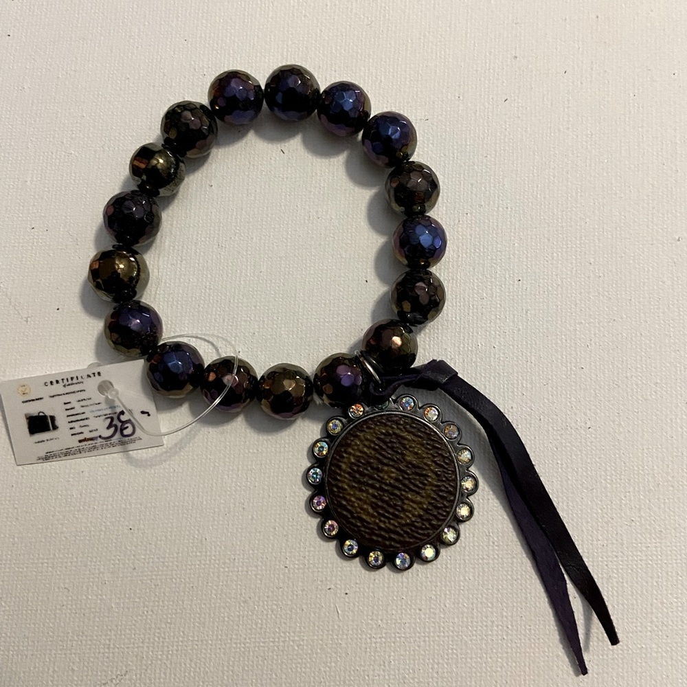 Upcycle bracelet w/ oil slick beads. Never worn.